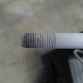 End of fiberglass rod after threads are cut